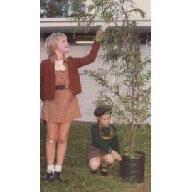 Brownie Guides Cathy and Sally preparing a tree for planting Munro Reserve, Doubleview