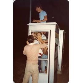 Boys having fun in the phone boxes on Rosewood Avenue in Woodlands c1980 