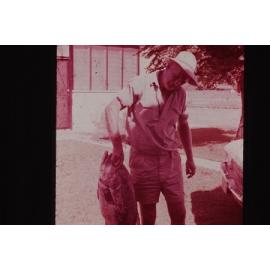 Beb Arbuckle holding a fish on the Arbuckle market garden in Gwelup