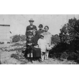 Group of people, outside the North Beach house