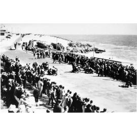 Spectators watch the Ariel Tourist Trophy race through North Beach