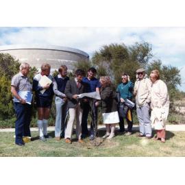 Architect Richard Llorens holding plans during Mount Flora Regional Museum construction