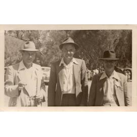 Three men photographed outdoors at an Arbuckle family event