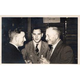 Three men at an Arbuckle family event