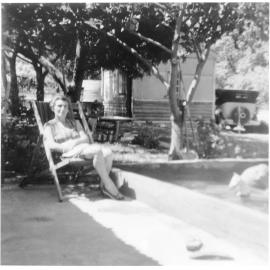 Allan Maddox's mother sitting in the back yard of the Balga property