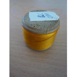 Wooden reel with gold-orange silk-cotton thread
