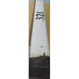 Timber weatherboard painted white with house number 321